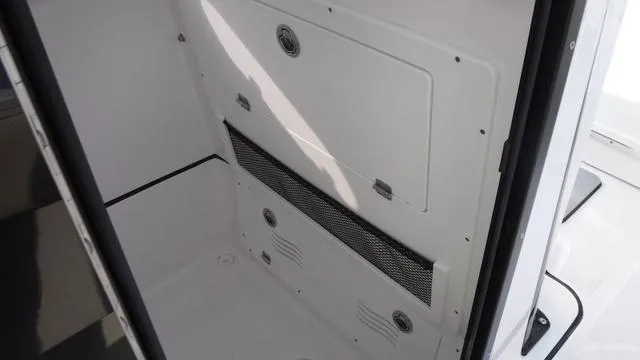 Slide: The Image of Interior compartment of 2023 Blue Wave 2800 Makaira boat, featuring storage access. - 27