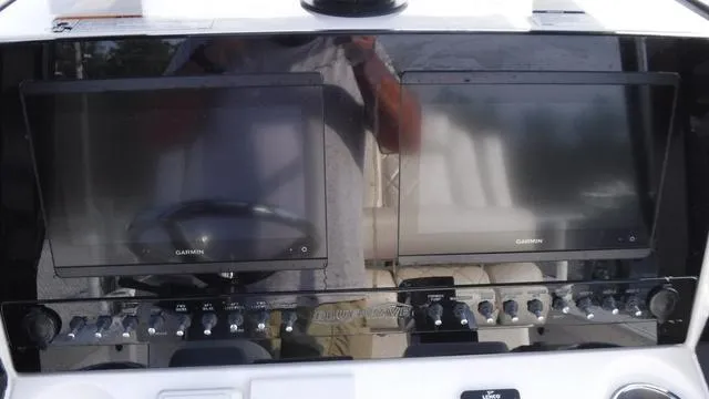 Slide: The Image of Dashboard of 2023 Blue Wave 2800 Makaira boat with dual Garmin displays. - 29