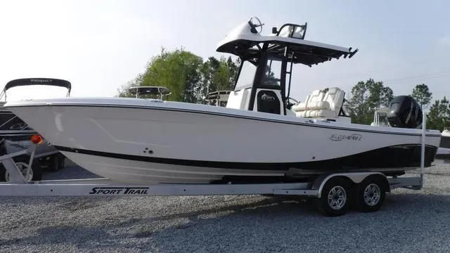 Slide: The Image of 2023 Blue Wave 2800 Makaira boat on trailer, side view. - 3