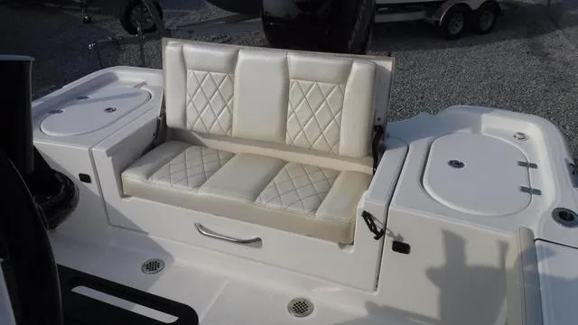 Slide: The Image of 2023 Blue Wave 2800 Makaira boat with cushioned seating and storage. - 33