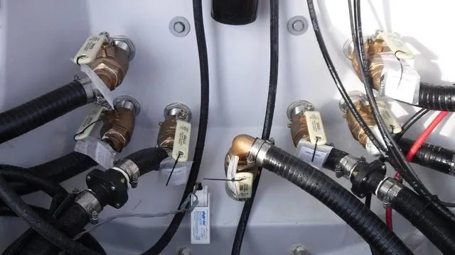 Slide: The Image of Close-up of 2023 Blue Wave 2800 Makaira boat plumbing system with hoses and valves. - 36