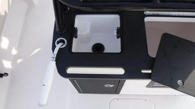 Slide: The Image of 2023 Blue Wave 2800 Makaira boat sink and storage area. - 39