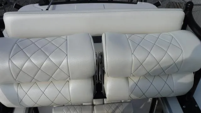 Slide: The Image of 2023 Blue Wave 2800 Makaira boat seats with diamond-stitched white upholstery. - 48