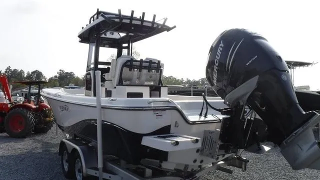 Slide: The Image of 2023 Blue Wave 2800 Makaira boat with Mercury engine on trailer. - 5