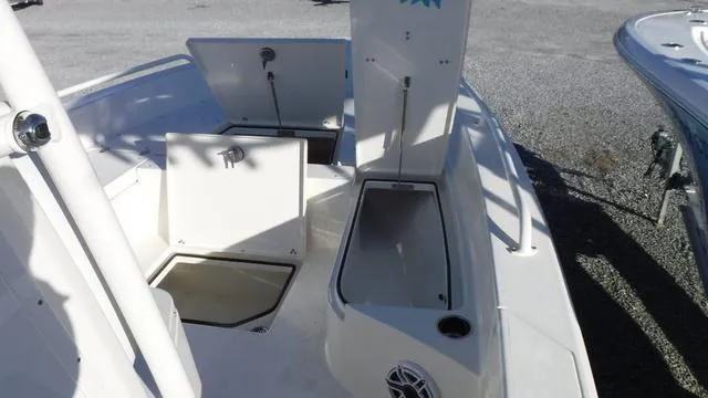 Slide: The Image of 2024 Pathfinder 2600 TRS boat with open storage compartments on deck. - 10