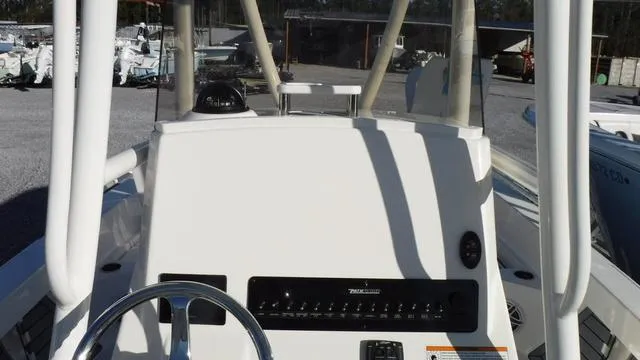 Slide: The Image of 2024 Pathfinder 2600 TRS boat console with steering wheel and control panel. - 12