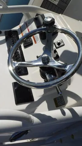Slide: The Image of 2024 Pathfinder 2600 TRS boat steering wheel and control panel. - 16