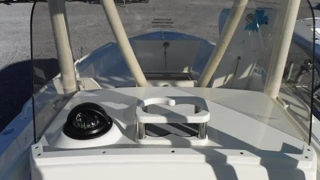 Slide: The Image of 2024 Pathfinder 2600 TRS boat dashboard with compass and sturdy handrails. - 19