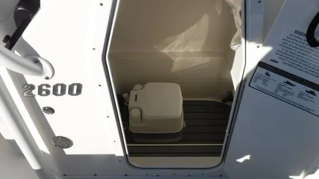 Slide: The Image of 2024 Pathfinder 2600 TRS boat interior with compact toilet. - 20