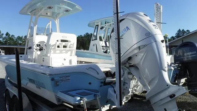 Slide: The Image of 2024 Pathfinder 2600 TRS boat with Yamaha outboard motor, parked on a trailer. - 4