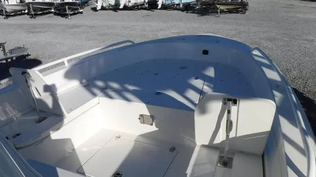 Slide: The Image of 2024 Pathfinder 2600 TRS boat interior with spacious deck and seating area. - 8