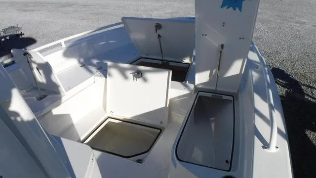 Slide: The Image of 2024 Pathfinder 2600 TRS boat with open storage compartments. - 9