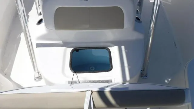 Slide: The Image of 2024 Bulls Bay 2200 boat interior with seating and storage compartment. - 10