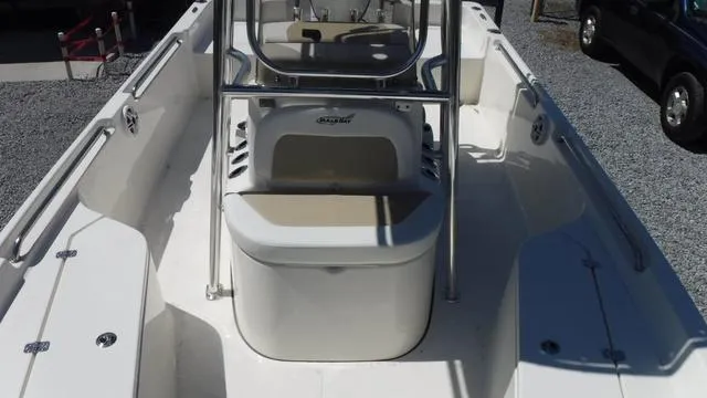 Slide: The Image of 2024 Bulls Bay 2200 boat interior with seating and storage compartments. - 12