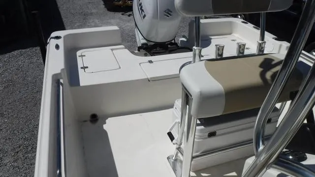 Slide: The Image of 2024 Bulls Bay 2200 boat interior with seating and motor. - 14