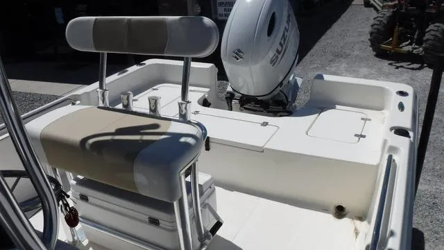 Slide: The Image of 2024 Bulls Bay 2200 boat with Suzuki outboard motor, featuring a comfortable seating area. - 16