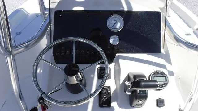 Slide: The Image of 2024 Bulls Bay 2200 boat dashboard with steering wheel and controls. - 17