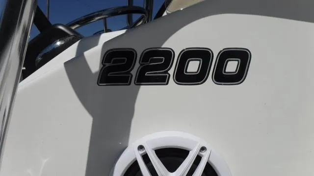 Slide: The Image of 2024 Bulls Bay 2200 boat model with steering wheel and speaker detail. - 21
