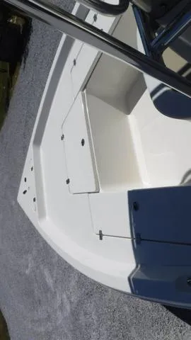 Slide: The Image of 2024 Bulls Bay 2200 boat deck with storage compartments. - 5