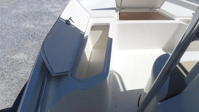 Slide: The Image of 2024 Bulls Bay 2200 boat storage compartments and seating area. - 9