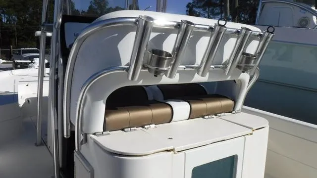 Slide: The Image of 2013 ShearWater 25 Bay boat interior with rod holders and seating. - 19