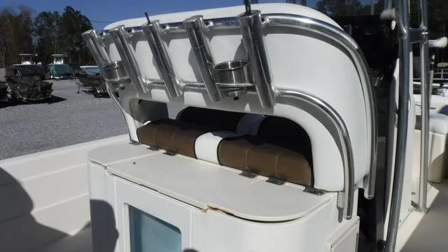 Slide: The Image of 2013 ShearWater 25 Bay boat with rod holders and storage compartment. - 20