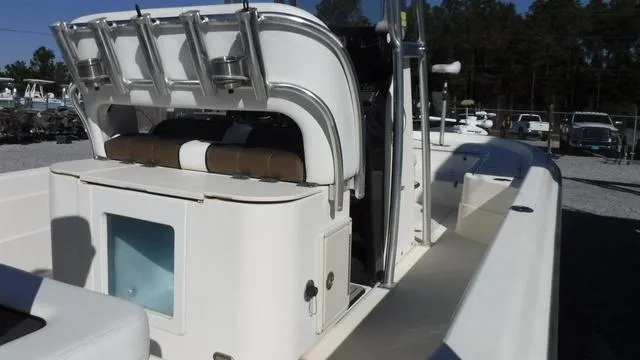 Slide: The Image of 2013 ShearWater 25 Bay boat interior with seating and storage compartments. - 27