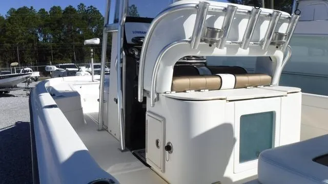 Slide: The Image of 2013 ShearWater 25 Bay boat interior with rod holders and seating. - 28