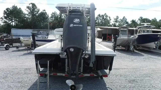 Slide: The Image of 2013 ShearWater 25 Bay boat with Mercury engine, parked in a marina. - 3