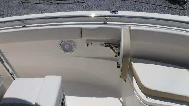 Slide: The Image of 2025 Bulls Bay 255 CC boat interior with seating and speaker. - 10