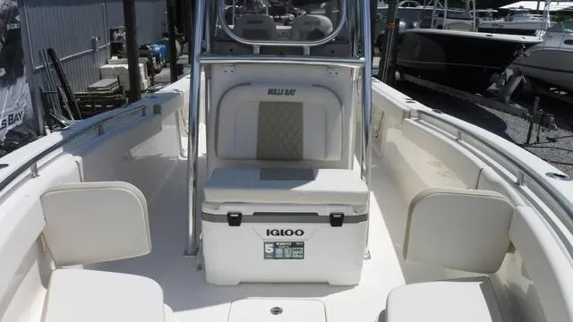 Slide: The Image of 2025 Bulls Bay 255 CC boat interior with Igloo cooler and seating. - 15