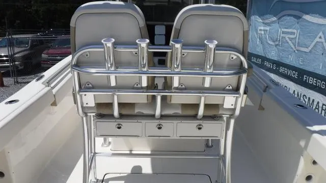 Slide: The Image of 2025 Bulls Bay 255 CC boat interior with rod holders and storage drawers. - 23