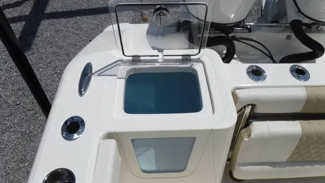 Slide: The Image of 2025 Bulls Bay 255 CC boat with open storage compartment and seating area. - 25