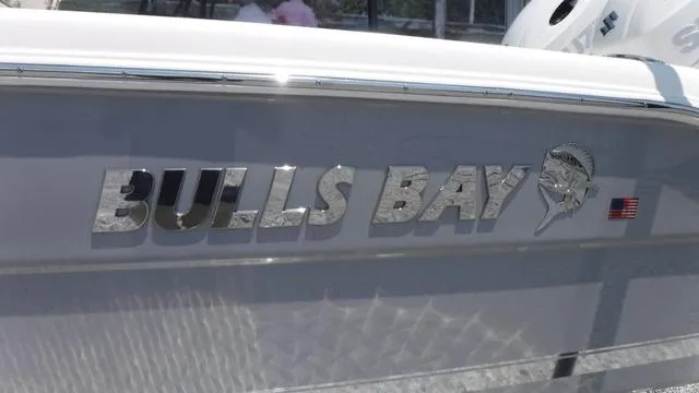 Slide: The Image of Bulls Bay 255 CC 2025 boat logo with American flag detail. - 3