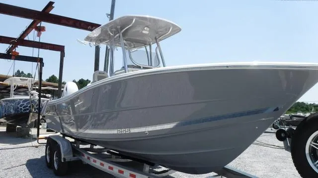 Slide: The Image of 2025 Bulls Bay 255 CC boat on trailer, sleek design, outdoor setting. - 8