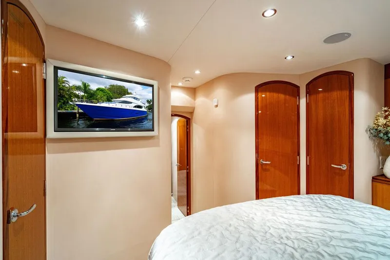 Slide: The Image of Luxurious 2007 Hatteras Enclosed Flybridge yacht interior with elegant wood finishes and modern decor. - 28