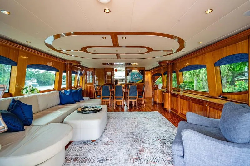Slide: The Image of Luxurious interior of 2007 Hatteras Enclosed Flybridge yacht with elegant seating and dining area. - 6