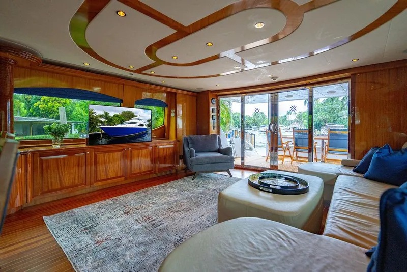Slide: The Image of Luxurious interior of 2007 Hatteras Enclosed Flybridge yacht with elegant wood finishes and modern decor. - 7