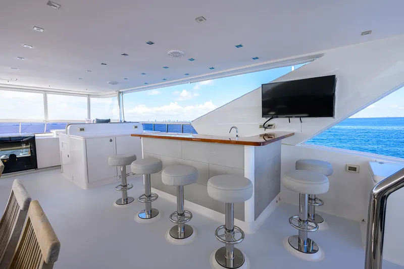 Slide: The Image of Luxurious 2018 Hargrave 100 yacht bar area with ocean view and modern seating. - 11