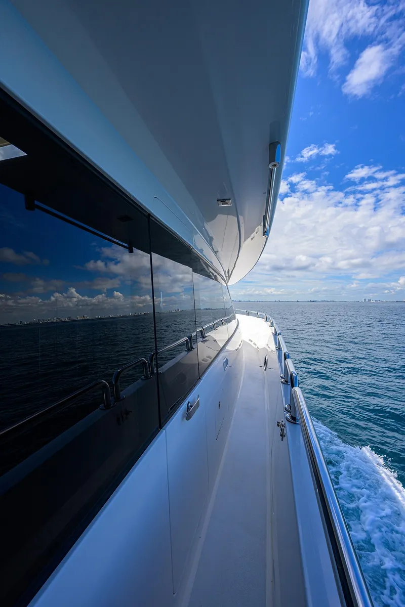 Slide: The Image of Side view of 2018 Hargrave 100 Raised Pilothouse yacht cruising on open sea. - 18