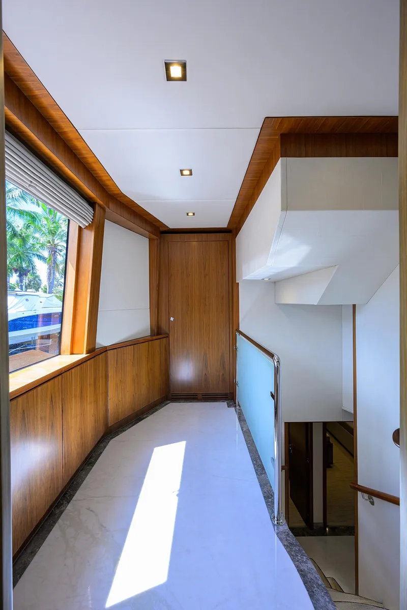 Slide: The Image of Luxurious interior hallway of 2018 Hargrave 100 Raised Pilothouse yacht with wood paneling. - 39