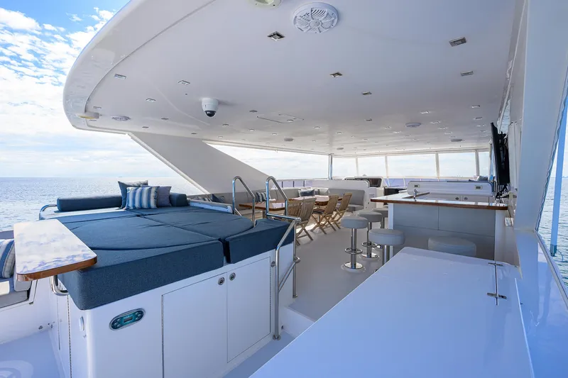 Slide: The Image of Luxurious 2018 Hargrave 100 Raised Pilothouse yacht deck with seating and ocean view. - 9