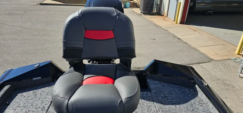 Slide: The Image of 2025 Tracker Pro Team 175 Crappie Edition boat seat, black and red design. - 12