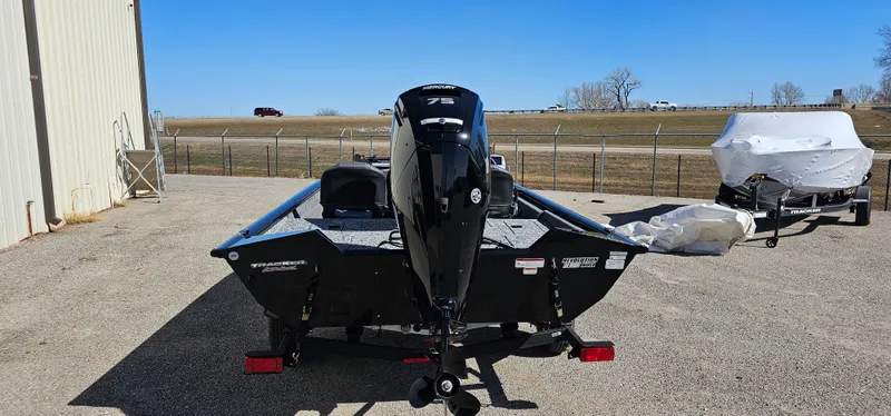 Slide: The Image of 2025 Tracker Pro Team 175 Crappie Edition boat, rear view, parked outdoors. - 3