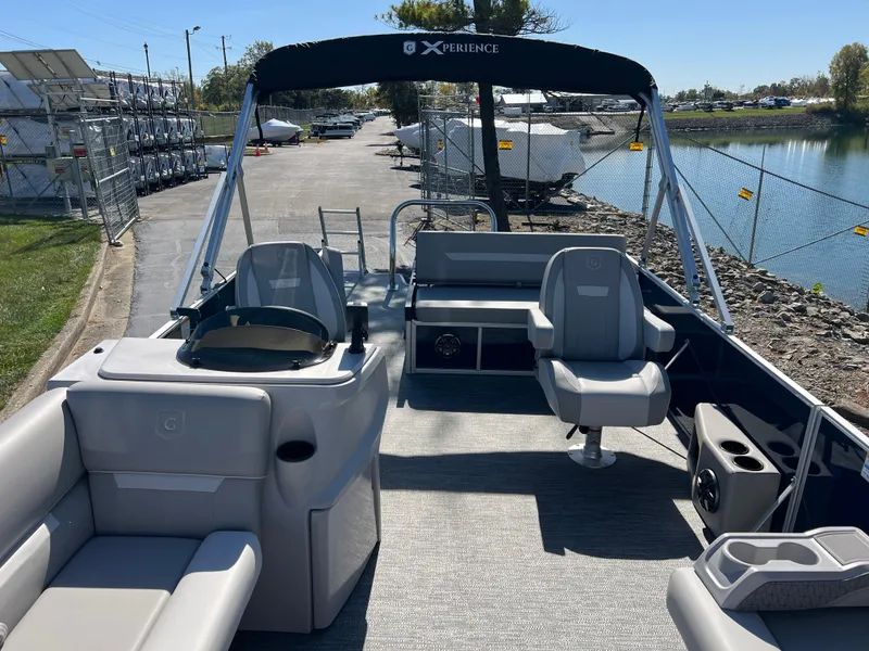 Slide: The Image of 2025 Godfrey Xperience 2286 SFL pontoon boat with spacious seating and modern design. - 11