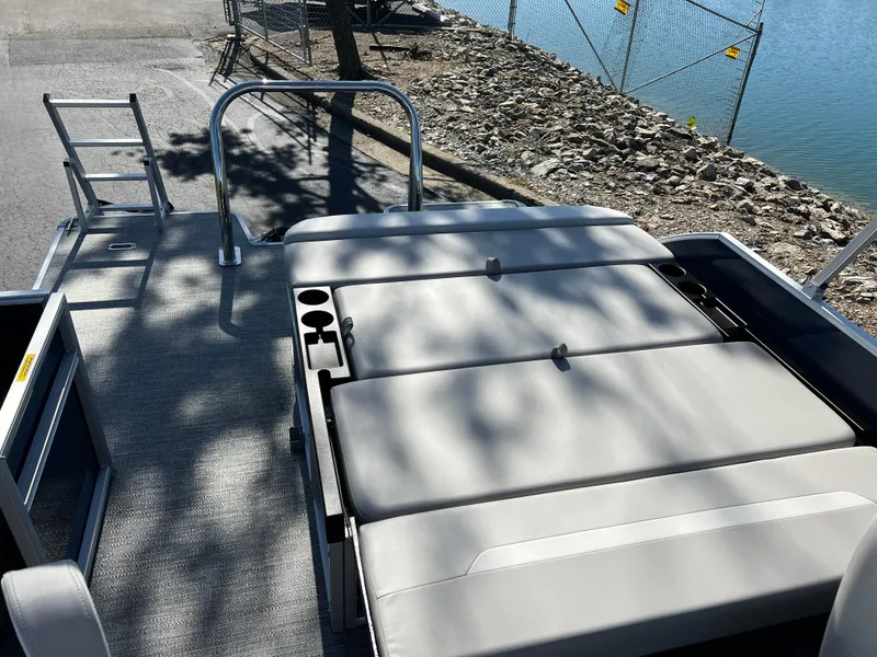 Slide: The Image of 2025 Godfrey Xperience 2286 SFL boat with sun deck and water view. - 18