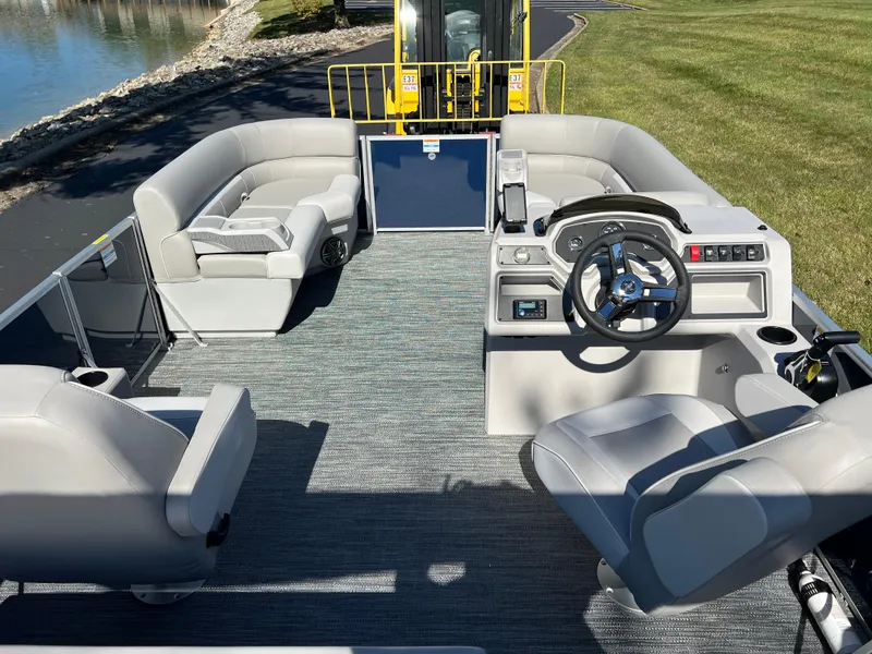 Slide: The Image of 2025 Godfrey Xperience 2286 SFL pontoon boat interior with modern seating and steering console. - 21
