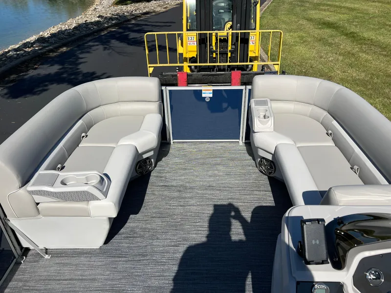 Slide: The Image of 2025 Godfrey Xperience 2286 SFL pontoon boat interior with gray seating and carpet. - 24