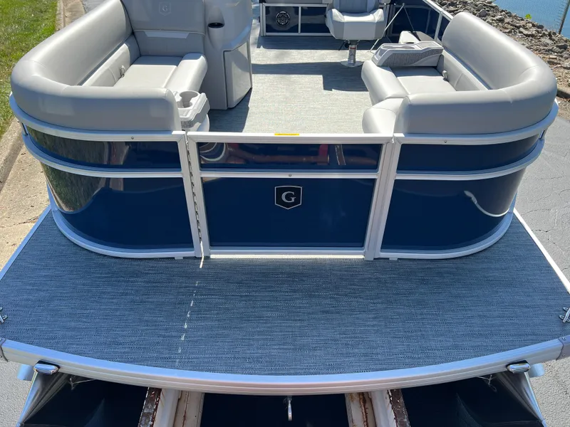 Slide: The Image of 2025 Godfrey Xperience 2286 SFL pontoon boat with spacious seating and sleek design. - 8