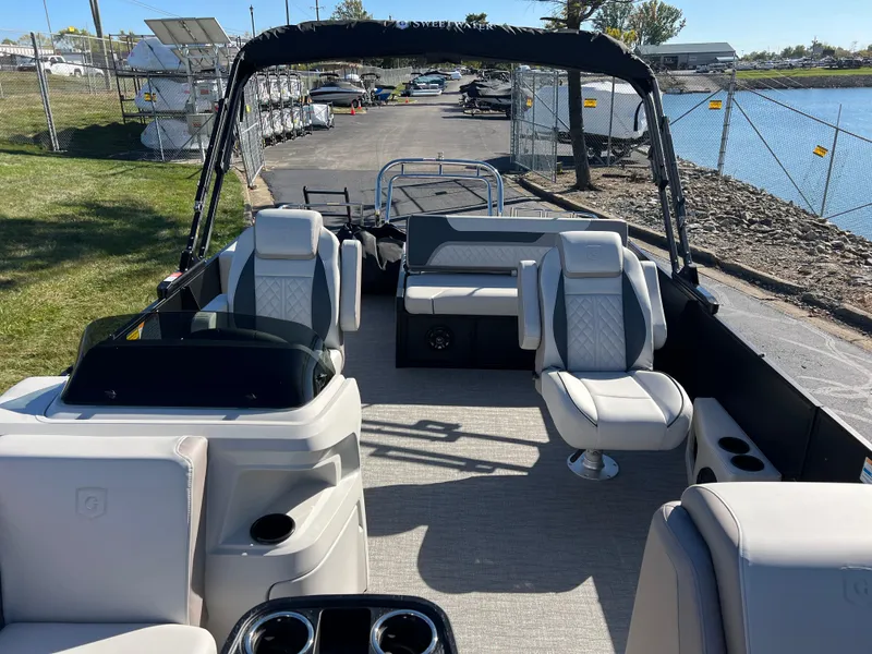 Slide: The Image of 2025 Godfrey SWEETWATER 2286 SFL pontoon boat interior with seating and helm. - 13